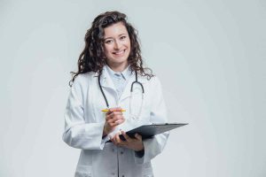 curly haired doctor with white robe and notepad
